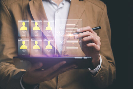 Businessman showing virtual icons, assessment checkboxes ,data a